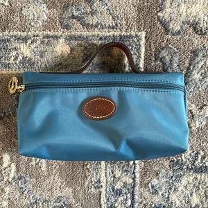 Small blue pilage nylon pouch with leather top